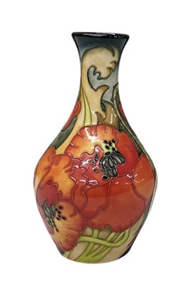 Lot 463 - EMMA BOSSONS FOR MOORCROFT; a vase decorated...