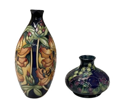 Lot 464 - WILLIAM MOORCROFT; a green ground floral...