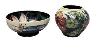 Lot 477 - MOORCROFT; a blue and cream ground floral...