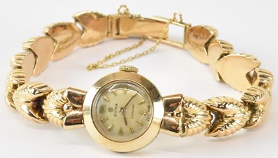 Lot 915 - CYMA; a 9ct yellow gold lady's wristwatch, on...