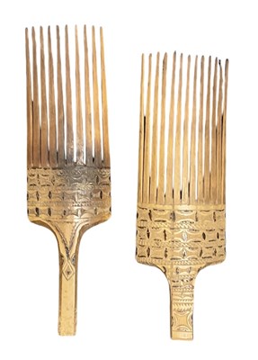 Lot 1134 - A pair of carved wooden combs Sepik, both with...