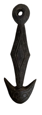 Lot 1053 - A carved wooden hook, used for hanging the...