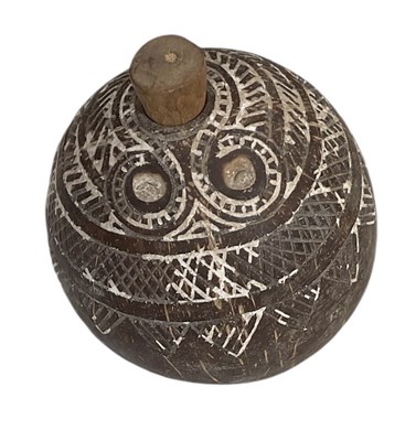Lot 1133 - An Melanesian carved coconut flask, with white...