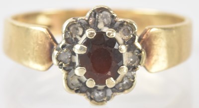 Lot 846 - A 9ct yellow gold red and white stone set...