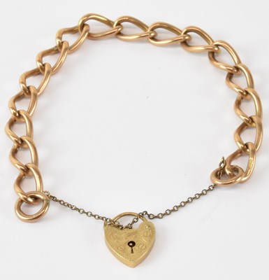 Lot 733 - A 9ct yellow gold bracelet with padlock clasp,...