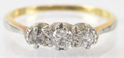 Lot 752 - An 18ct yellow gold three stone diamond ring,...