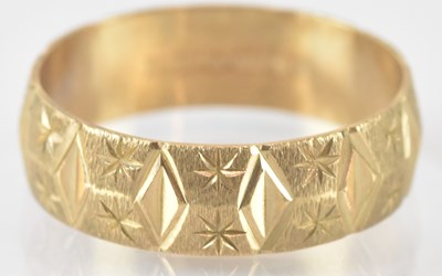 Lot 874 - A 9ct yellow gold wedding band, size N, approx...