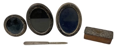 Lot 698 - Two oval hallmarked silver easel back...
