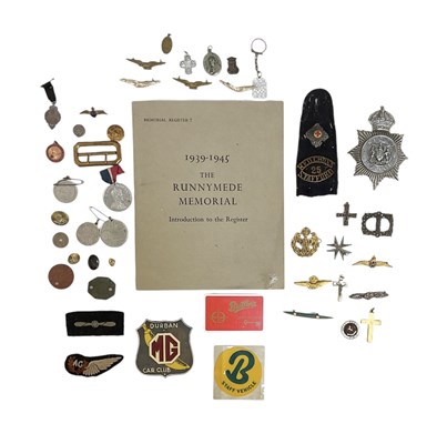 Lot 343 - A collection of military badges, buttons and...