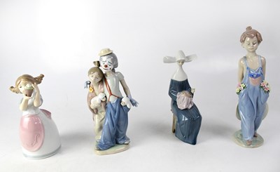 Lot 332 - LLADRÓ; four figures comprising a young boy...