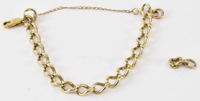 Lot 782 - A 9ct yellow gold bracelet, with three spare...