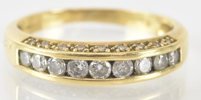 Lot 766 - An 18ct yellow gold diamond ring, set with...