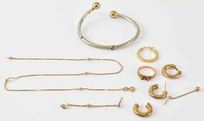 Lot 784 - A 9ct yellow and white gold bangle, diameter...
