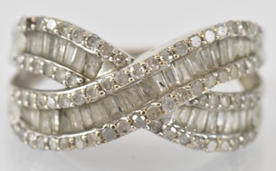 Lot 826 - A 9ct white gold diamond set ring, total...