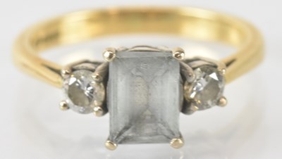 Lot 785 - An 18ct yellow gold blue and white stone set...