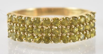 Lot 824 - A 9ct yellow gold Apache demantoid garnet ring,...