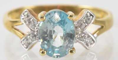 Lot 837 - A 9ct yellow gold zircon set ring, the central...