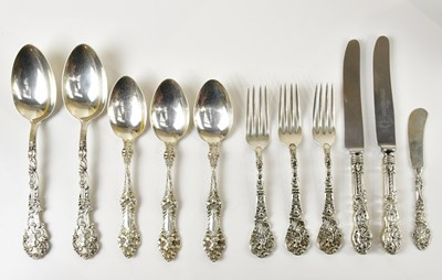 Lot 1441 - A collection of sterling silver flatware with...