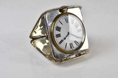 Lot 1445 - A sterling silver cased travelling clock, the...