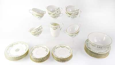 Lot 301 - LIMOGES; a part tea set, printed with...