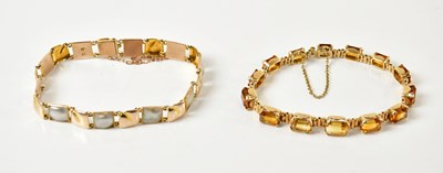 Lot 1470 - A yellow metal and citrine bracelet, set with...