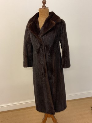 Lot 85 - A full length dark brown mink coat with 3/4...