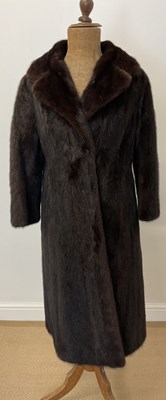 Lot 85 - A full length dark brown mink coat with 3/4...