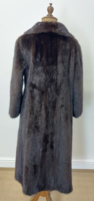 Lot 85 - A full length dark brown mink coat with 3/4...