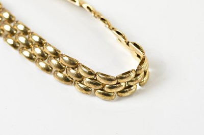 Lot 1565 - A 9ct yellow gold brick link bracelet, length...