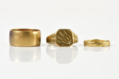 Lot 1468 - Three 9ct yellow gold rings including a broad...