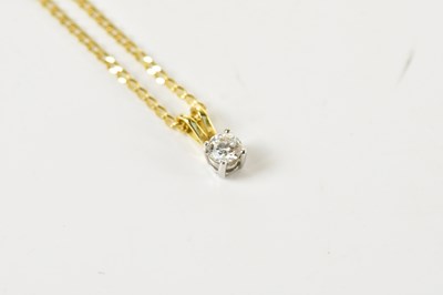 Lot 1627 - An 18ct yellow gold and diamond pendant, the...