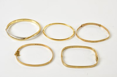 Lot 1539 - Five 9ct yellow gold bangles, combined approx...