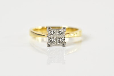 Lot 1338 - An 18ct yellow gold and diamond ring set with...