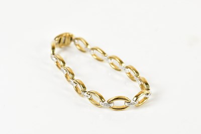 Lot 1547 - A 9ct yellow gold diamond set open oval link...