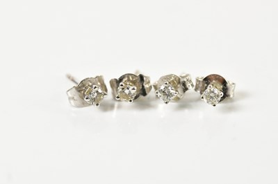 Lot 1677 - A pair of 18ct white gold and diamond set ear...