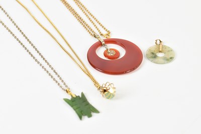 Lot 1650 - Three yellow metal chains supporting pendant...
