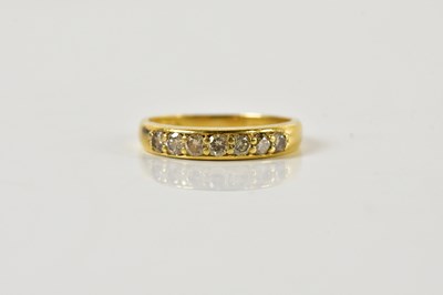 Lot 1526 - An 18ct yellow gold seven stone diamond half...