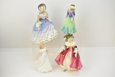 Lot 559 - ROYAL DOULTON; four porcelain figures...