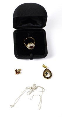 Lot 743 - A 9ct yellow gold garnet floral cluster ring