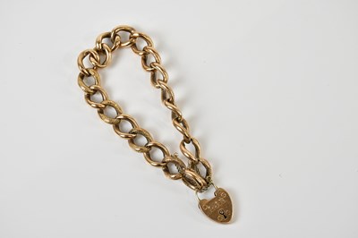 Lot 1569 - A 9ct yellow gold hollow curb link bracelet...