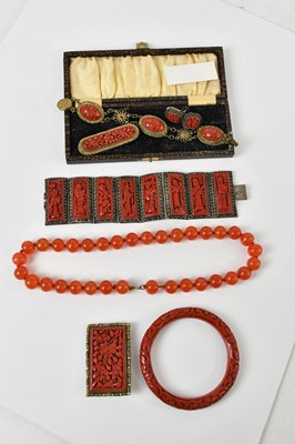 Lot 414 - A group of Chinese red lacquered jewellery...
