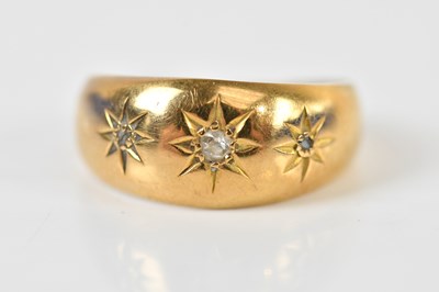 Lot 187 - An 18ct yellow gold diamond three stone ring,...