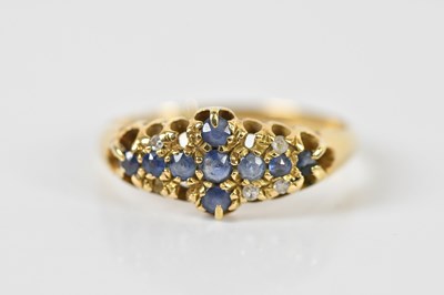 Lot 1512 - A yellow metal sapphire and diamond dress ring...