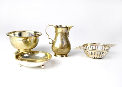 Lot 682 - A hallmarked silver tea strainer, London, a...