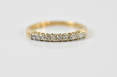 Lot 1450 - A 9ct yellow gold eleven stone diamond set...